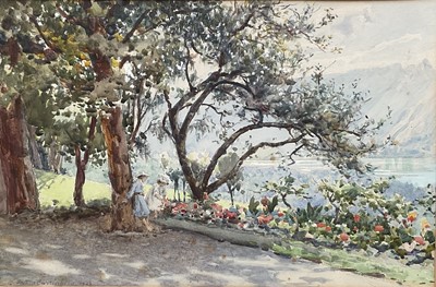 Lot 106 - Edwardian watercolour, children beneath trees by a lake, mountains beyond, indistinctly signed and dated 1902, glazed frame