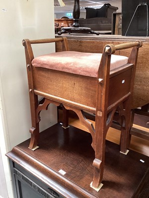 Lot 1254 - Arts & Crafts period oak stool in the Gothic style, together with tiny circular stool on three legs