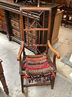 Lot 1270 - Antique fruitwood adjustable reclining country armchair, together with single elm chair with rope back, together with unusual 19th century pine Canterbury with acorn finials (3)