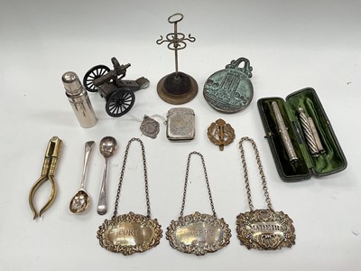 Lot 1027 - Two silver decanter labels, one other plated, silver propelling pencil in fitted case, silver vesta case, silver fob and other items