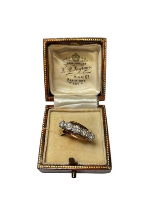 Lot 75 - 1930s diamond five stone ring in platinum crossover illusion setting on 18ct gold shank, stamped 'Bravingtons'.