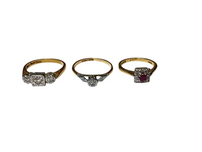 Lot 77 - Art Deco 1930s diamond three stone ring in platinum illusion setting on 18ct gold shank, another similar single stone ring and a ruby and diamond cluster ring also in 18ct gold setting (3)