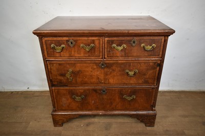Lot 1530 - Early 18th century walnut chest of two short and two long drawers on bracket feet