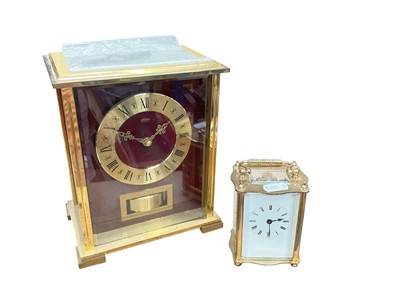 Lot 497 - Brass carriage clock together with a German quartz mantel clock (2).