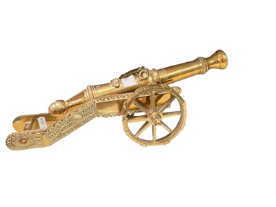 Lot 711 - Ornate Brass cannon on carriage