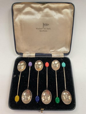 Lot 1021 - Set of six silver and enamel bean end coffee spoons in a fitted case