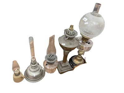 Lot 518 - Victorian brass oil lamp with cut glass reservoir and etched glass shade and other oil lamps and parts.