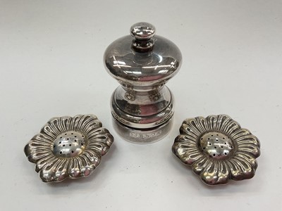 Lot 1017 - Contemporary silver pepper mill (London 1986) together with a pair of silver (800) flower head pepperettes