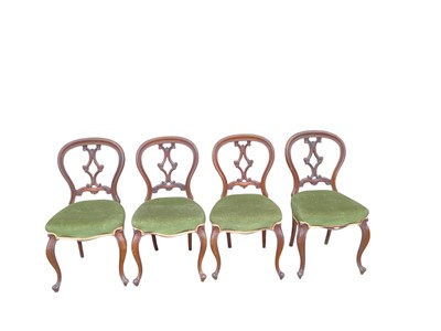 Lot 1381 - Set of four Victorian mahogany balloon back dining chairs with green velvet upholstered seats