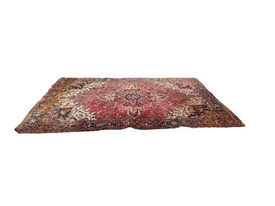 Lot 1333 - Eastern carpet on red ground
