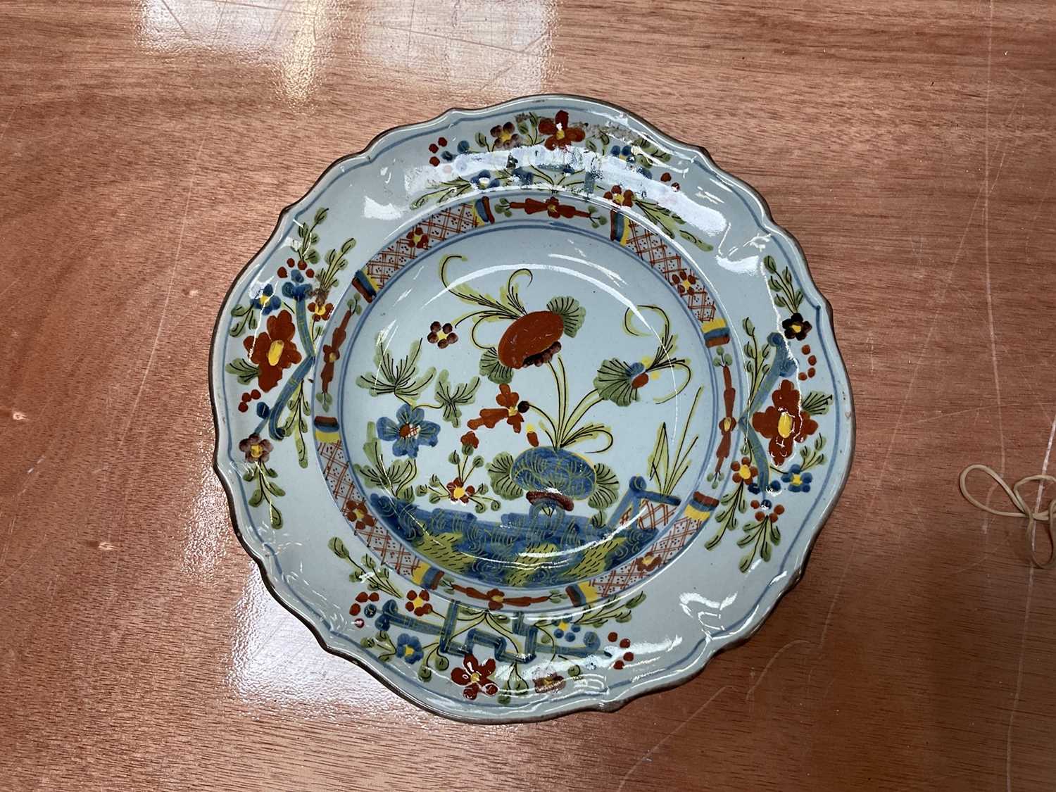 Lot 83 - Faenza faience plate, painted in famille verte palette