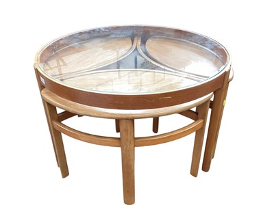 Lot 1247 - Mid century teak nest of tables