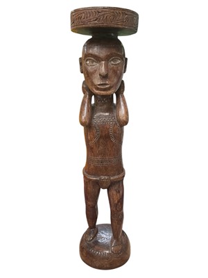 Lot 2529 - Papua New Guinea carved wood figure, hands on neck, 55.5cm in height.