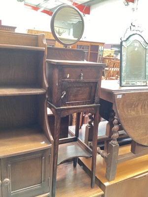 Lot 1271 - Oak shaving stand with circular mirror, drawer cupboard and undertier below together with a pine butcher's block (2)