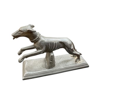 Lot 434 - 20th century pewter model of a racing grey hound, 13cm in height.