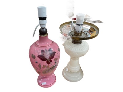 Lot 436 - Victorian pink glass vase converted into a lamp, and another similar opalescent glass oil lamp, converted into a lamp (2).