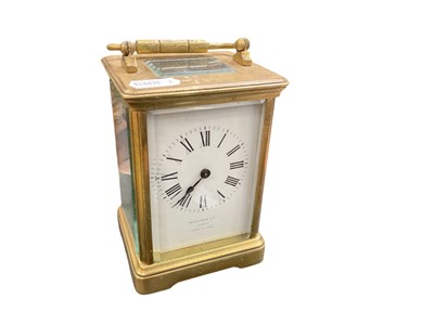 Lot 438 - Early 20th century brass carriage clock with white enamel dial, retailed by Benetfink & Co, London.