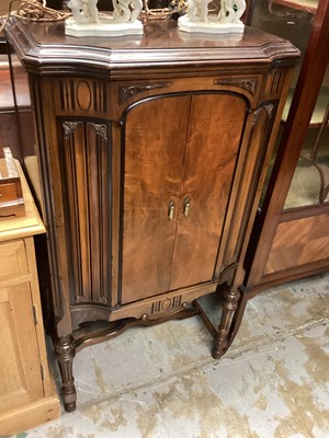 Lot 1292 - Mahogany cabinet with two doors on fluted turned supports joined by stretchers, 67cm wide, 46cm deep, 125cm high