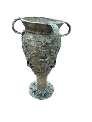 Lot 450 - Benin type bronzed metal four handled vase, decorated in relief with insects and reptiles, 34cm in overall height.