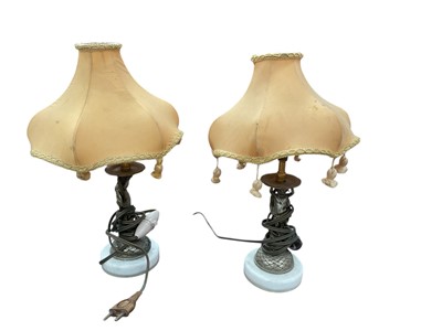 Lot 823 - Pair of French figural table lamps raise on white marble bases, each 21cm in height.