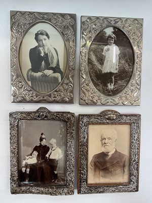 Lot 1079 - Late Victorian silver photograph frame, Edwardian silver photograph frame and a pair of plated frames (4)
