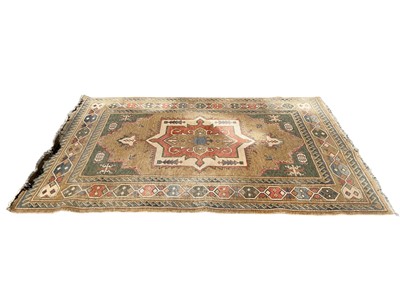 Lot 1315 - Eastern rug with central medallion on brown, beige, green, red and blue ground, 287cm x 198cm