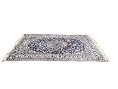 Lot 1316 - Eastern rug with central medallion on red, blue and cream ground, 295cm x 196cm