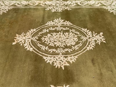 Lot 1326 - Large Indian rug with central medallion on green and cream ground, 368cm x 279cm