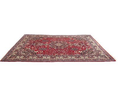 Lot 1334 - Large eastern carpet decorated with animals and birds on red blue and cream ground, 344cm x 247cm