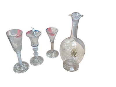 Lot 493 - 18th century drinking glass with air twist stem, together with two other drinking glasses and a decanter with coronet (3).