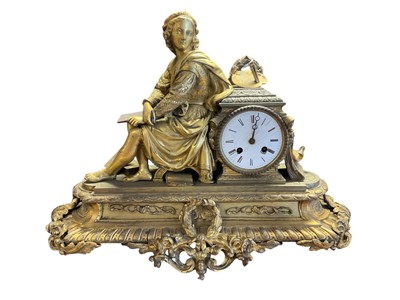 Lot 253 - 19th century French gilt metal figural mantel clock, asymmetric form with figural surmount emblematic of the arts, circular enamel dial