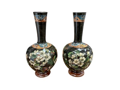Lot 119 - A pair of Doulton Lambeth faience bottle vases, painted with foliage, impressed '1878' to base, artist's monogram for Mary Aitken, 30cm high