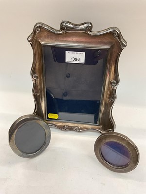 Lot 1096 - Silver photograph frame and two other smaller oval/round silver photograph frames (3)