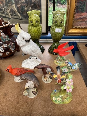 Lot 89 - Pair of Burmantofts type majolica green glazed owl spill vases with glass eyes, together with a group of ceramic bird ornaments