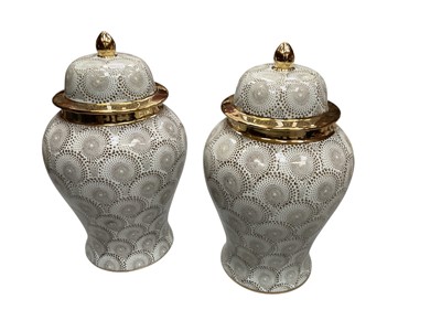Lot 527 - Pair of contemporary baluster vases and covers and a group of bisque figures.