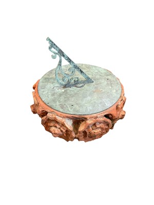 Lot 1399 - Antique bronze sundial on a terracotta and composite base. Sundial measuring 38cm round.