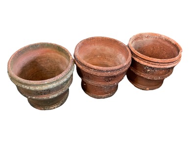 Lot 1401 - Three large terracotta planters. Approximately 45cm tall by 50cm wide.