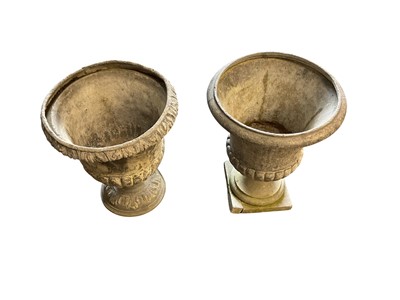 Lot 1404 - Two lead garden urns of campana form. The largest is approximately 40cm tall by 30cm wide.