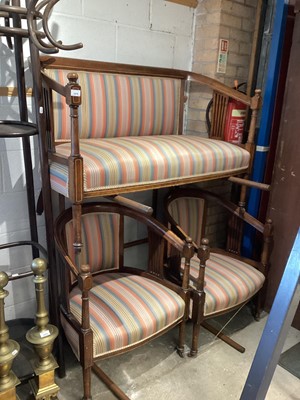 Lot 1416 - Edwardian inlaid mahogany framed sofa with striped upholstery together with a pair of matching tub chairs