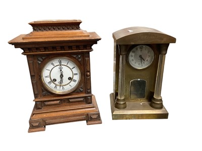Lot 102 - German oak cased mantel clock, and a brass cased Anglesey Weltime mantel clock (2)