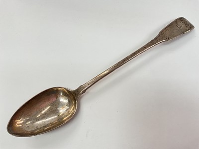 Lot 1141 - Georgian silver serving spoon with engraved crest (London 1806)