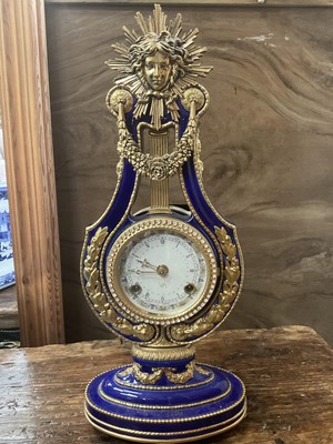 Lot 822 - Reproduction clock in porcelain case