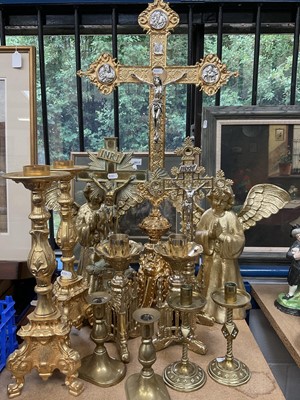 Lot 284 - Three brass crucifixes, various brass alter candlesticks and similar candlesticks