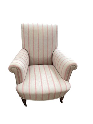 Lot 1450 - Victorian deep armchair with striped upholstery on mahogany turned front legs