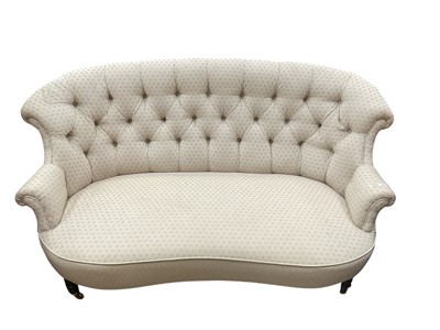 Lot 1451 - Victorian two seater sofa with buttoned upholstery on turned front legs and brass castors