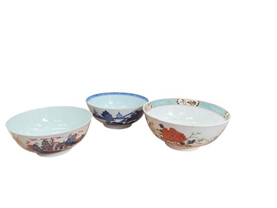 Lot 513 - Group of three 18th century Chinese porcelain punch bowls, with blue and white, Imari and polychrome decoration, the largest 26.5cm in diameter (3).