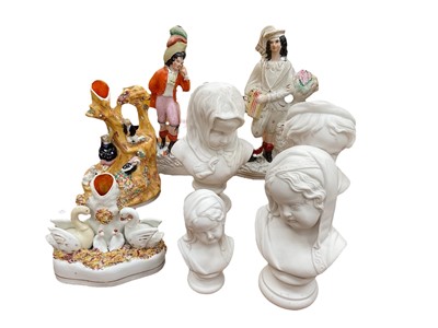 Lot 574 - Four 19th century Staffordshire pottery figure groups, Parian Bust of Grief, another of the crying child and another of winter and another parianware bust (8).