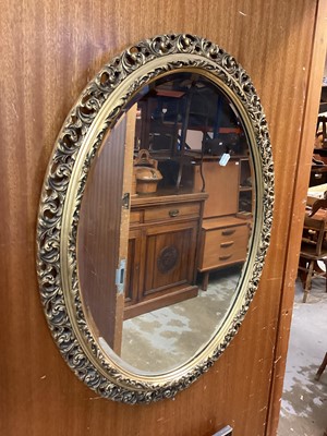 Lot 1469 - Oval bevelled wall mirror in ornate gilt frame with pierced decoration