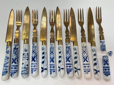 Lot 369 - Twelve 19th century continental blue and white porcelain handled dessert knives and forks