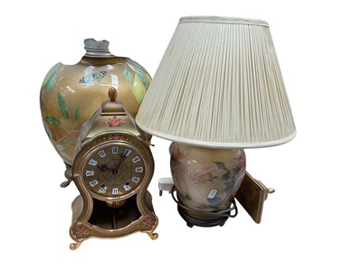Lot 634 - Three table lamps and a clock (4).